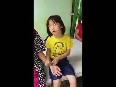 Blind Asian little girl recites the Quran beautifully.